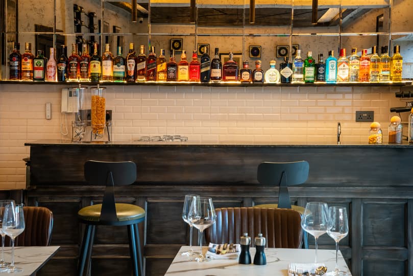 The Grill Room bar counter with premium spirits